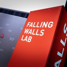 Photo of the Falling Walls Lab logo on a red background.
